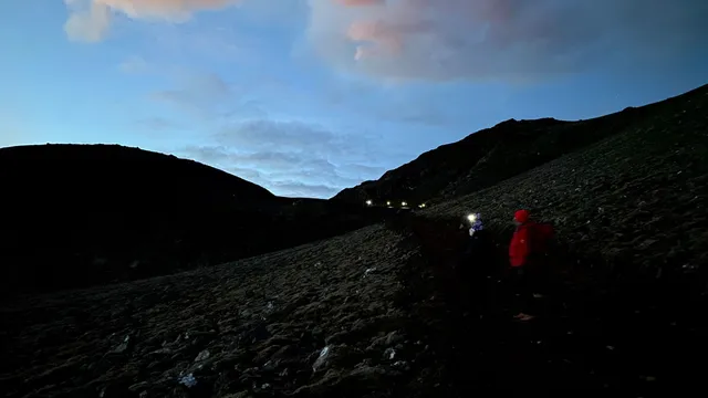 People hiking back from the Fagradalsfjall volcano in Iceland