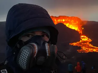 Wearing gas mask at a volcano eruption